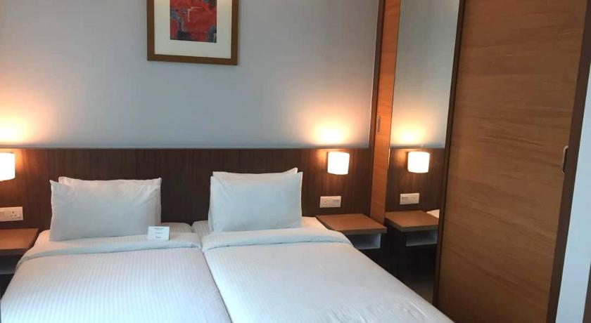 a hotel room with two beds and two lamps, UTM HOTEL & RESIDENCE in Kuala Lumpur