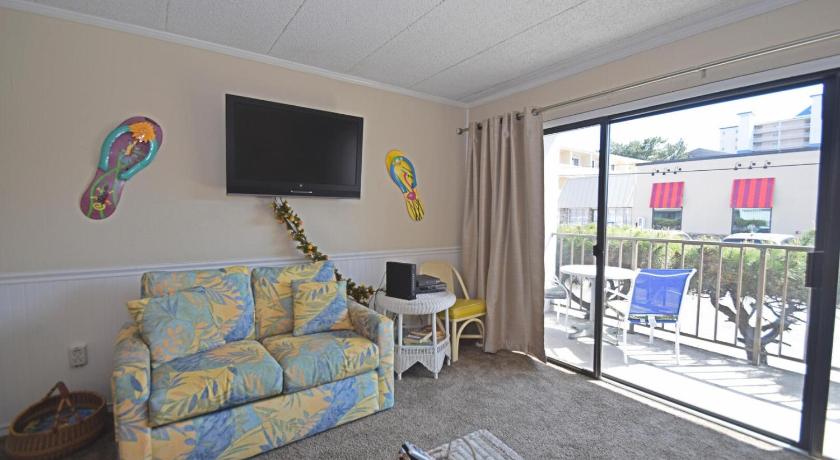 a living room filled with furniture and a tv, Shore Lea 102 in Ocean City (MD)
