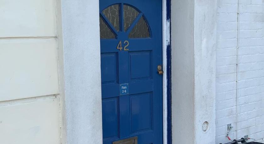 a blue door leading to a small room with a blue door, WIGHTHOLIDAY in Isle of Wight