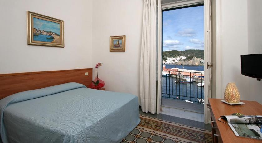 a hotel room with a bed and a television, Hotel Mari in Ponza Island