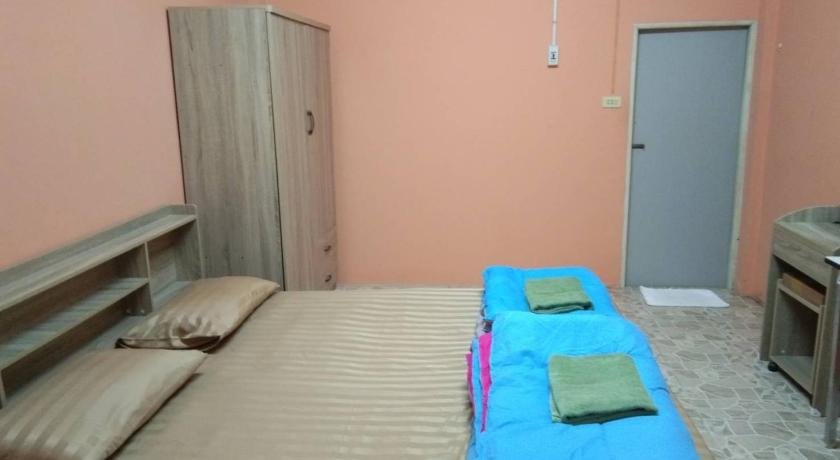 a bedroom with a bed and a television, E2S Place in Nakhon Nayok