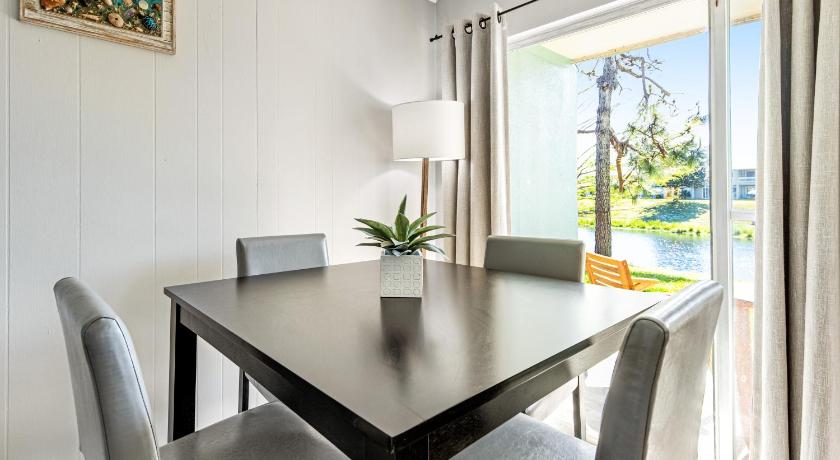 a dining room table with a white tablecloth, Gulf Terrace Condominiums in Destin (FL)