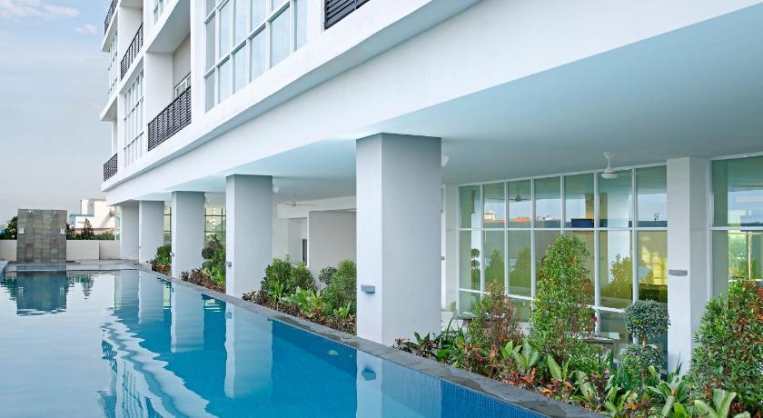a hotel room with a pool and a balcony, Hotel Santika Cikarang in Cikarang