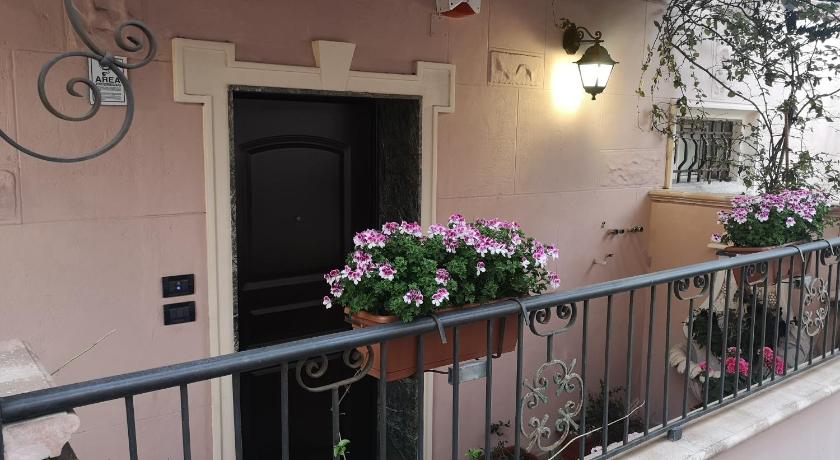 a balcony that has a bunch of flowers in it, Marilyn in Reggio Calabria