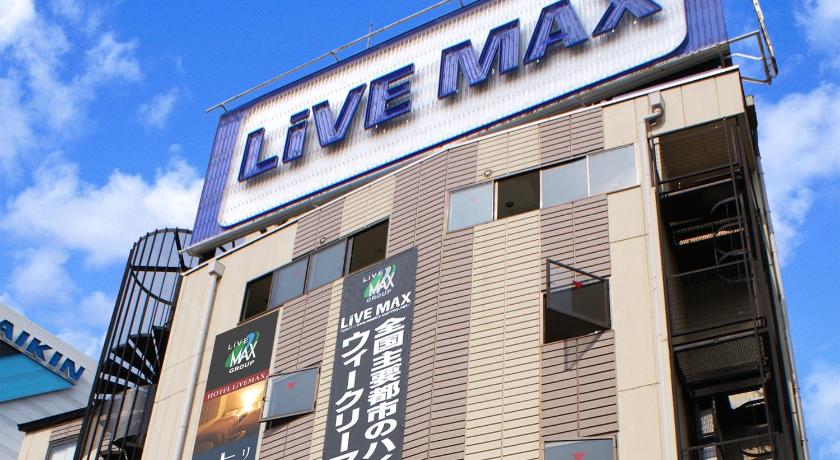 a building with a sign on the side of it, Hotel Livemax Shin Osaka in Osaka