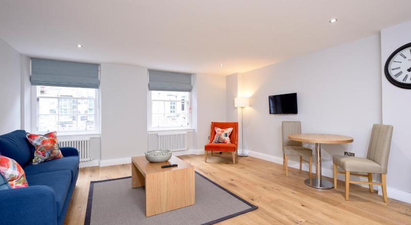 a living room filled with furniture and a tv, Destiny Scotland New Town Apartments in Edinburgh