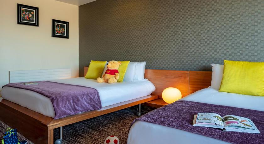 a bedroom with two beds and a desk, D Hotel in Drogheda