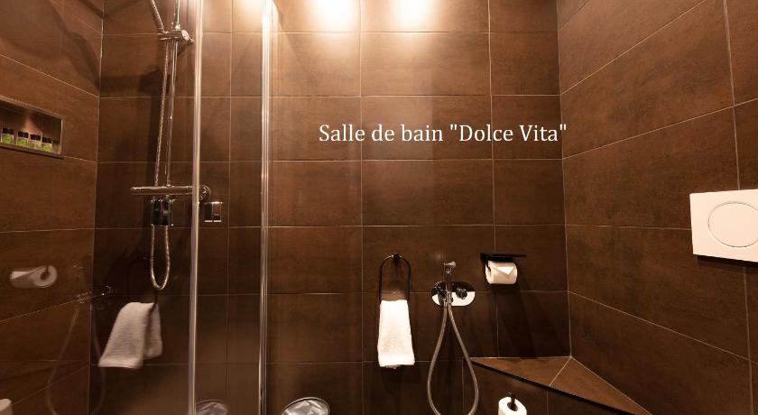 a bathroom with a toilet, sink, and shower stall, Love Hotel avec nuit insolite au Dandy et Jacuzzi privatise in Paris