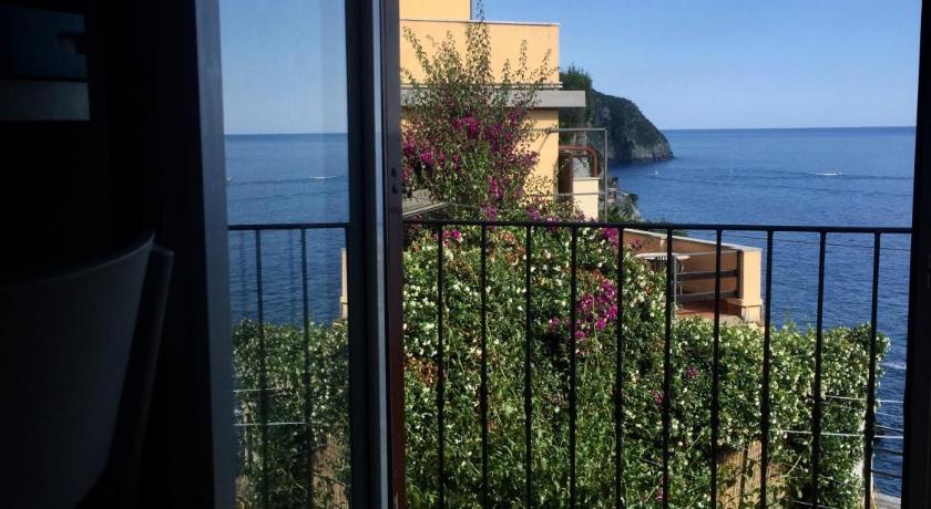 a view from the balcony of a house overlooking the ocean, Le Storie di Manarola in Riomaggiore