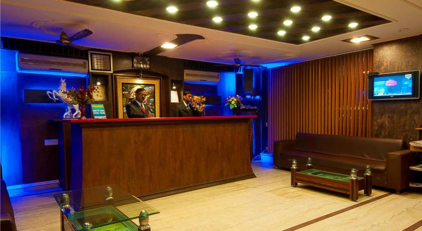 a living room filled with furniture and a tv, Hotel Vishal Residency in New Delhi and NCR