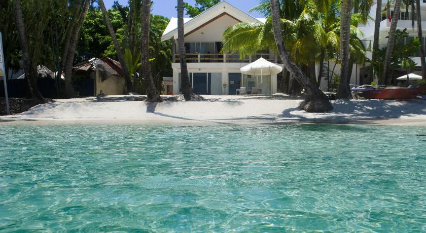 a beach scene with a pool and a house, Mabuhay Beach House                                                                              in Boracay Island