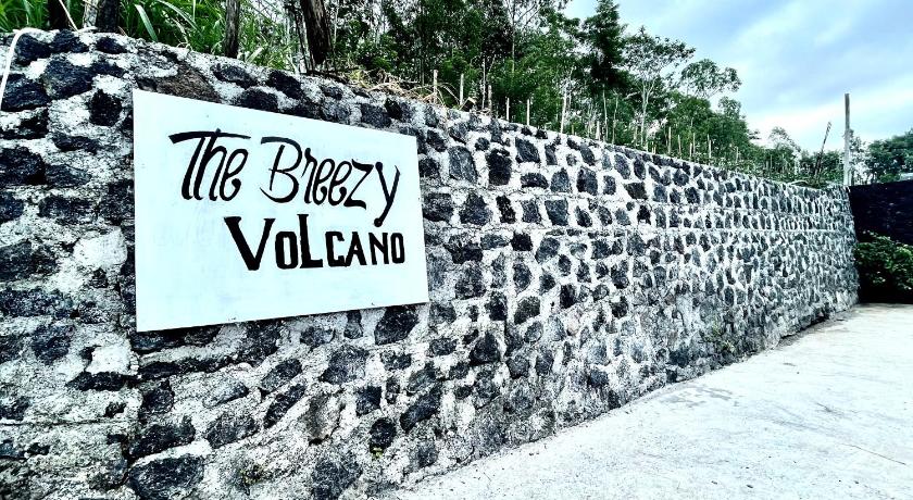 a sign on a wall with graffiti on it, The Breezy Volcano in Bali