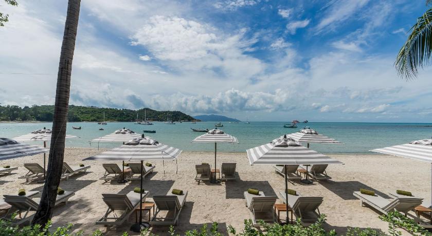 a beach filled with lots of beach chairs and umbrellas, Melia Koh Samui (SHA Extra plus) in Koh Samui