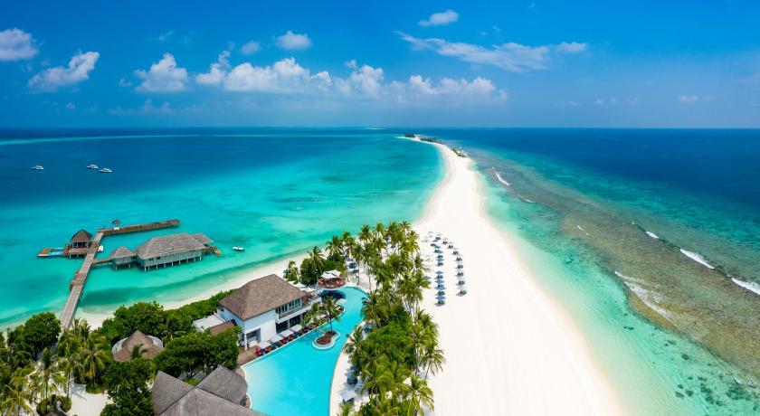 a beach scene with a large body of water, Finolhu Baa Atoll Maldives in Maldive Islands