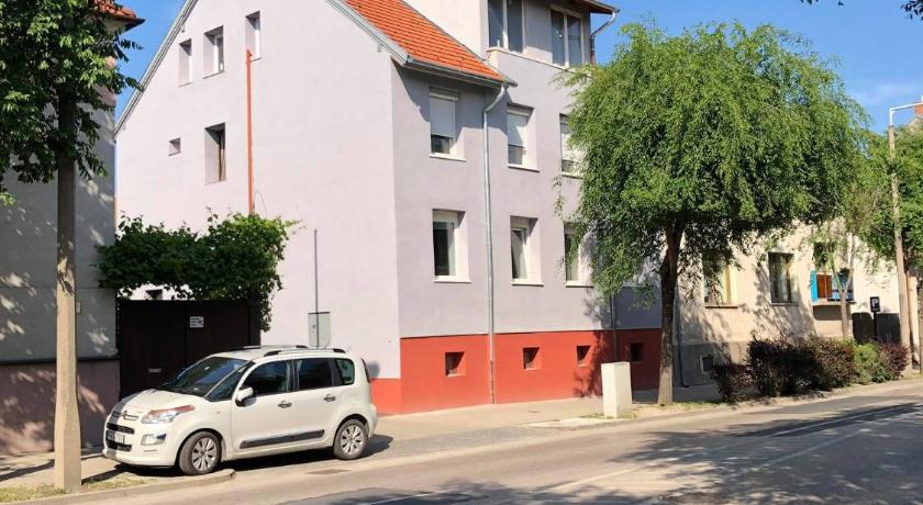 a car is parked in front of a house, Alpesi Apartman in Sopron