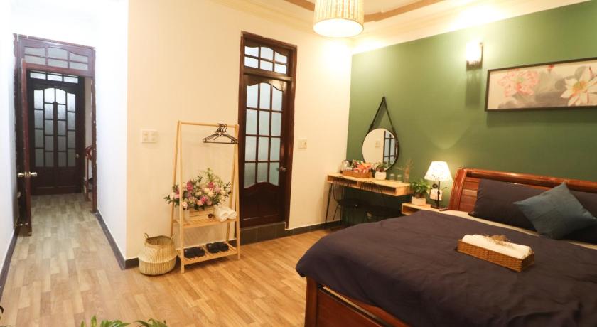 a bedroom with a bed and a desk, DALAT LEGEND homestay in Dalat