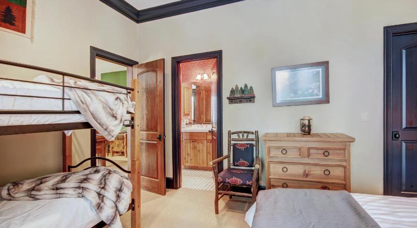 a bedroom with a bed and a desk, Ten Mile Estate Home in Breckenridge (CO)