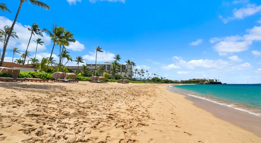 a sandy beach with palm trees and palm trees, Aston Maui Kaanapali Villas in Kaanapali (HI)
