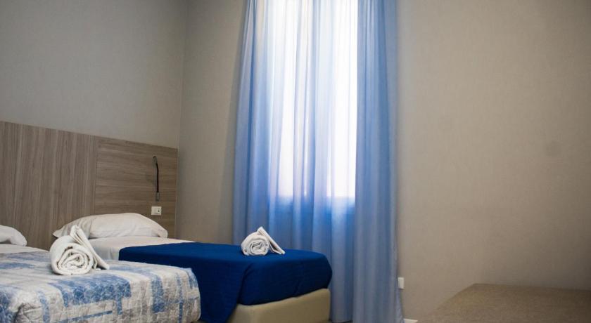 a bedroom with a bed and a window, Hotel Sant'Orsola City House in Bologna