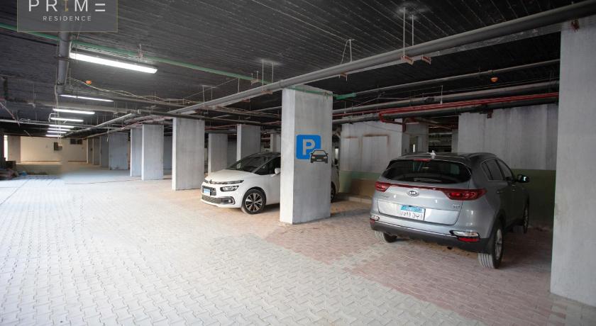 a car parked in a garage next to a building, Prime Residence New Alamein in El Alamein