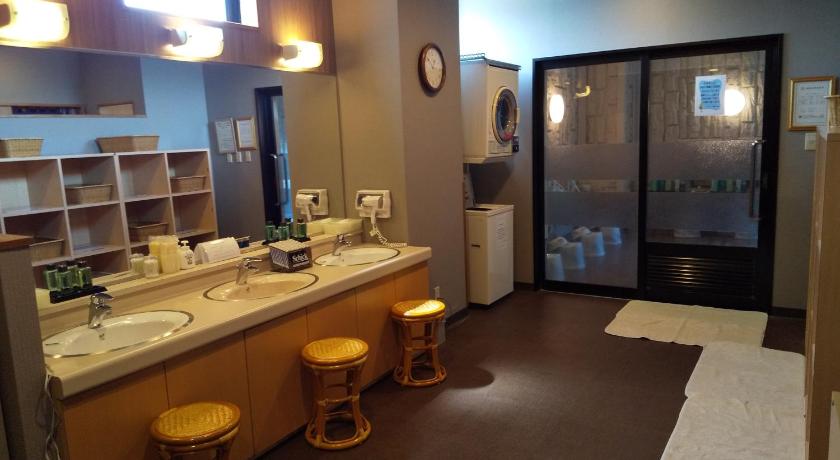 a bathroom with two sinks and a toilet, Hotel Route Inn Yonezawa Ekihigashi in Yonezawa