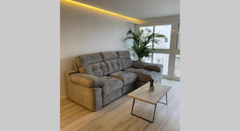 a living room with a couch and a table, PRECIOSO APARTAMENTO A ESTRENAR EN CENTRO DE NERJA in Nerja