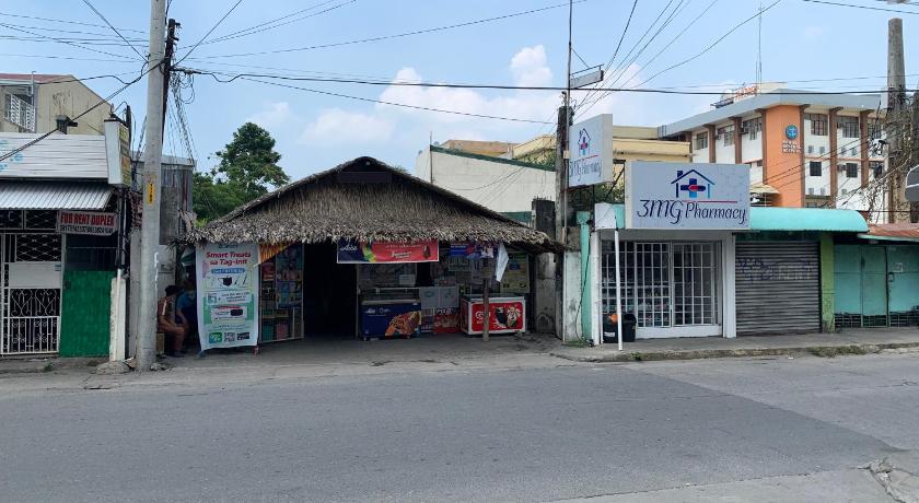 a street scene with a building and a street sign, Jow's Place in Tarlac