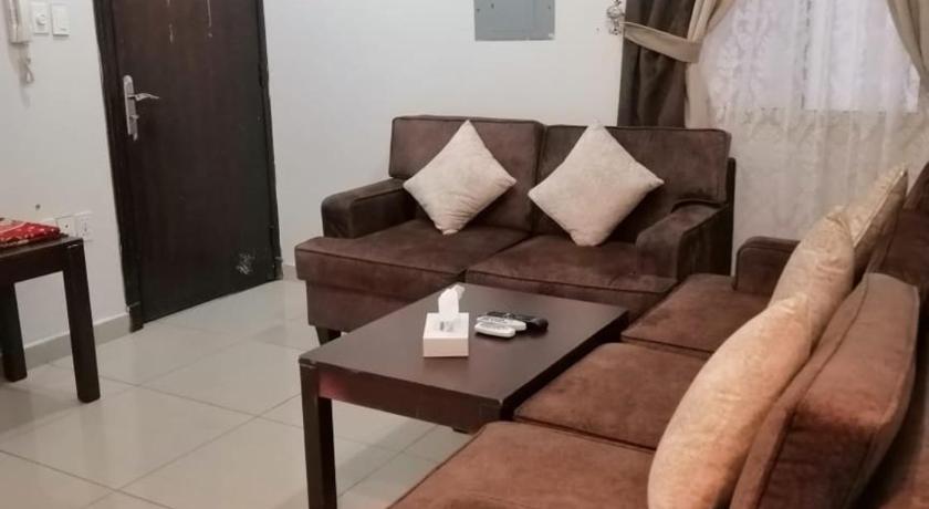 a living room with a couch and a table, Loaloat Al Khobar in Al-Khobar