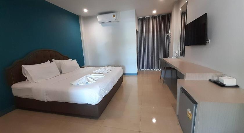a hotel room with a bed and a desk, ZLEEP D Hotel in Udon Thani