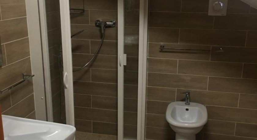 a bathroom with a toilet and a sink, Controvento in Casalbordino