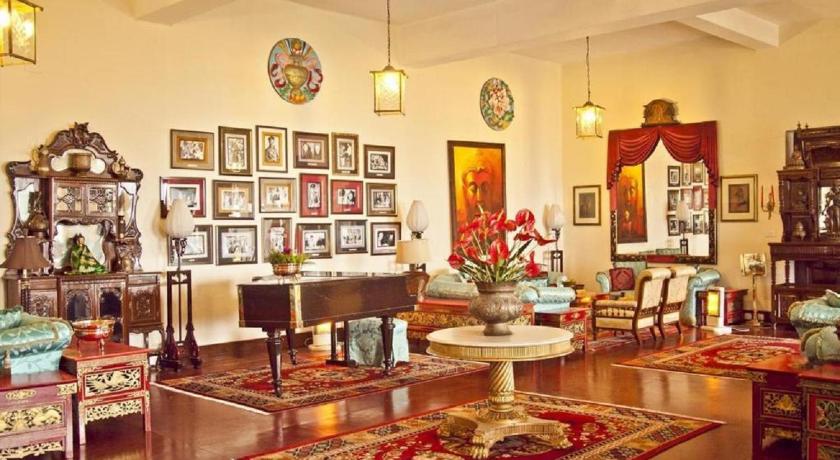 a living room filled with furniture and a piano, The Elgin Nor-Khill Gangtok in Gangtok
