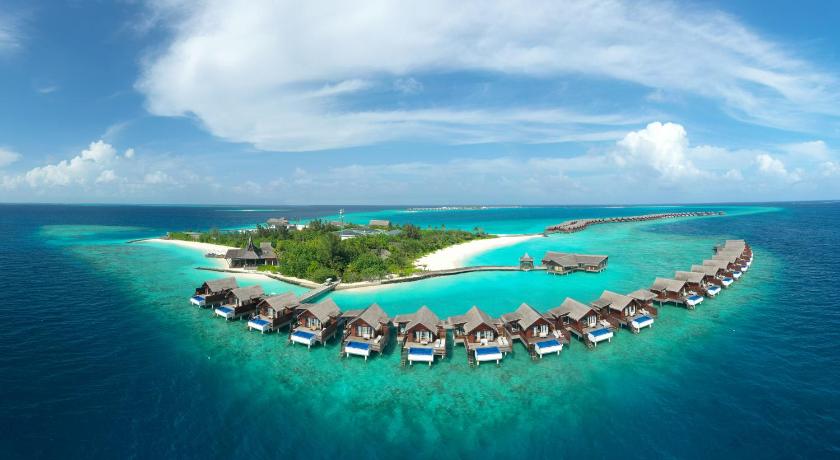 a large group of people sitting on top of a beach, Grand Park Kodhipparu Maldives in Maldive Islands