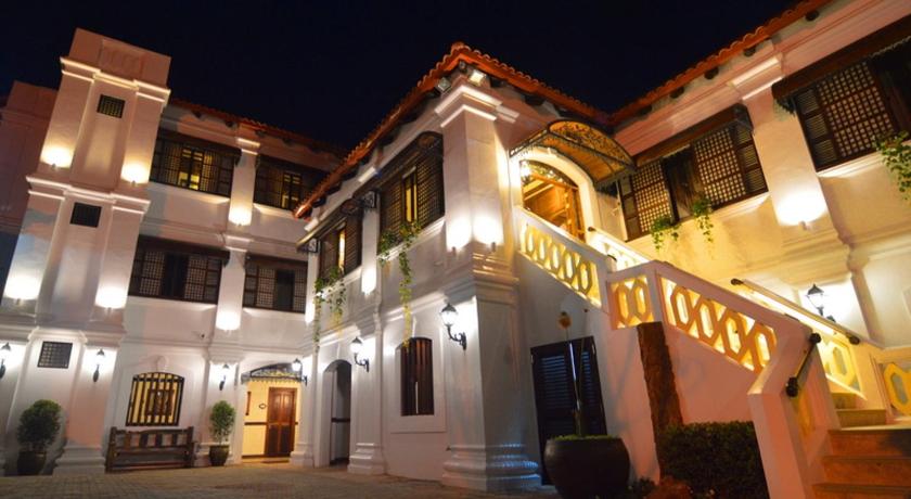 a large building with a clock on the front of it, Hotel Veneto de Vigan in Ilocos Sur