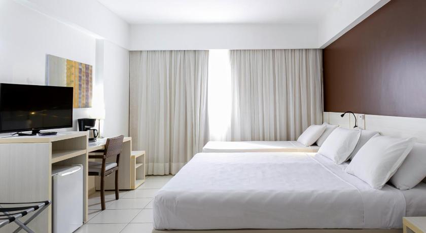 Image of 1 Queen And 1 Single, Nonsmoking, Deluxe Room, Half Board 1
