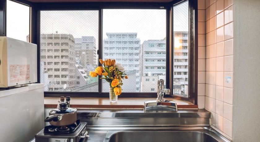 a kitchen with a sink and a window, LIBERTY PALACE Nipponbashi Station3 in Osaka