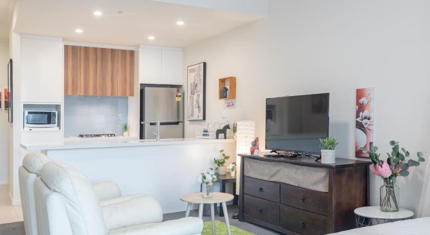 a living room filled with furniture and a tv, NEW! 2BR Apt in Hurstville 1Min To Train Sleep8 in Sydney