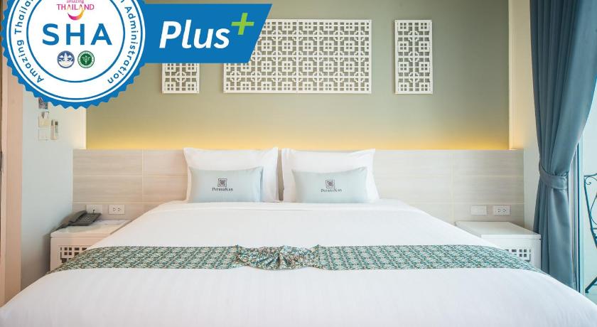 a hotel room with a bed and a clock on the wall, PeranaKan Boutique Hotel (SHA Plus+) in Phuket
