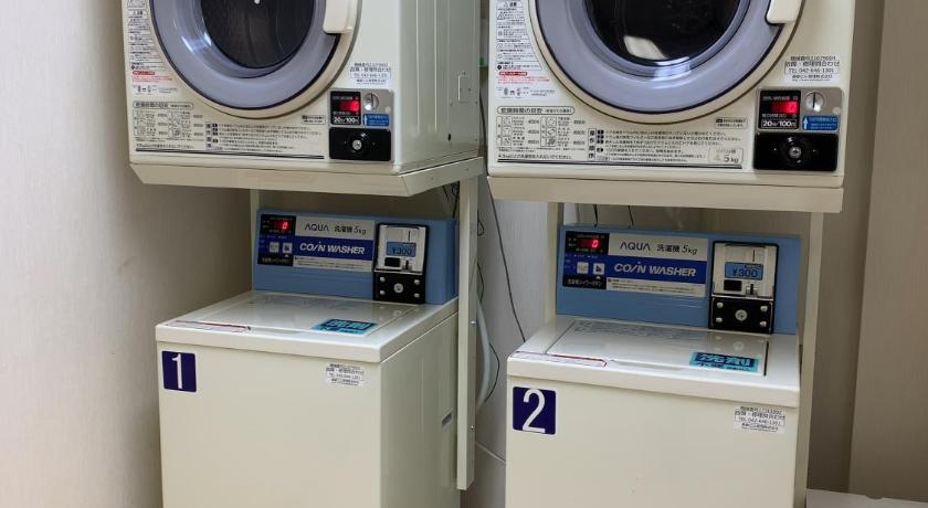 a row of white toilets sitting next to each other, Iioka Shiosai Hotel in Choshi