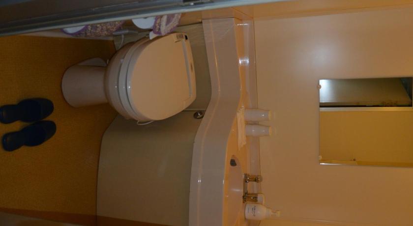 a bathroom with a toilet and a sink, Highland Furano in Furano