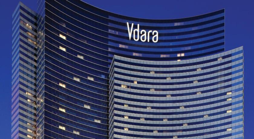 a large building with a clock on the front of it, Vdara Hotel & Spa at ARIA Las Vegas in Las Vegas (NV)
