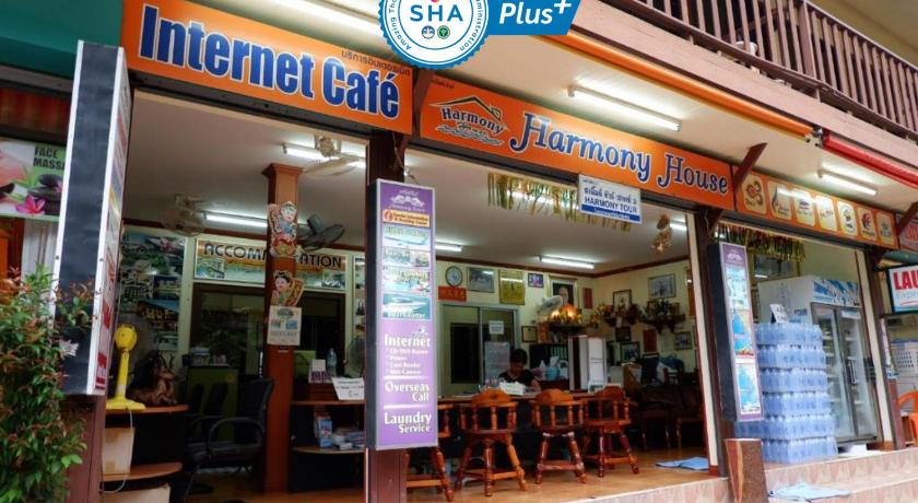 a restaurant with a sign on the side of the building, Harmony House (SHA Extra Plus) in Ko Phi Phi