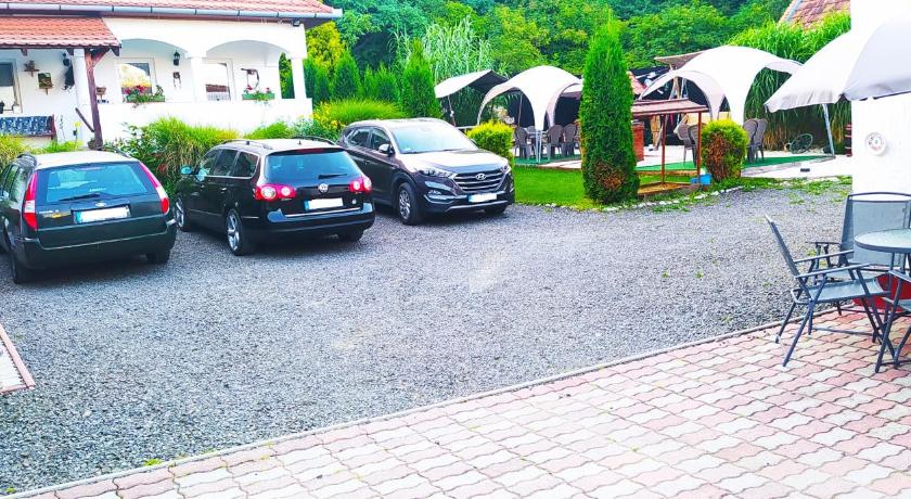 a car is parked in front of a house, Harmony Vendeghaz Egerszalok in Eger