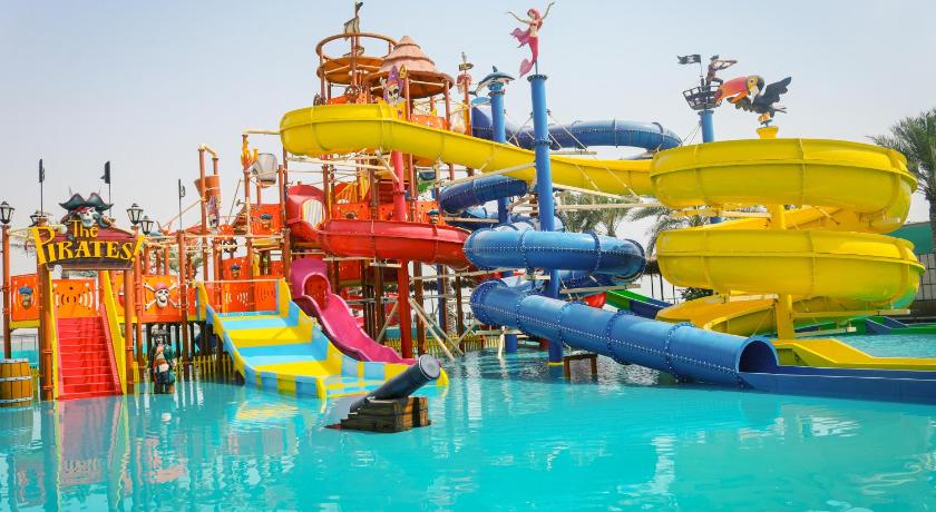 a pool filled with lots of colorful floats, Lagoona Beach Luxury Resort and Spa in Manama