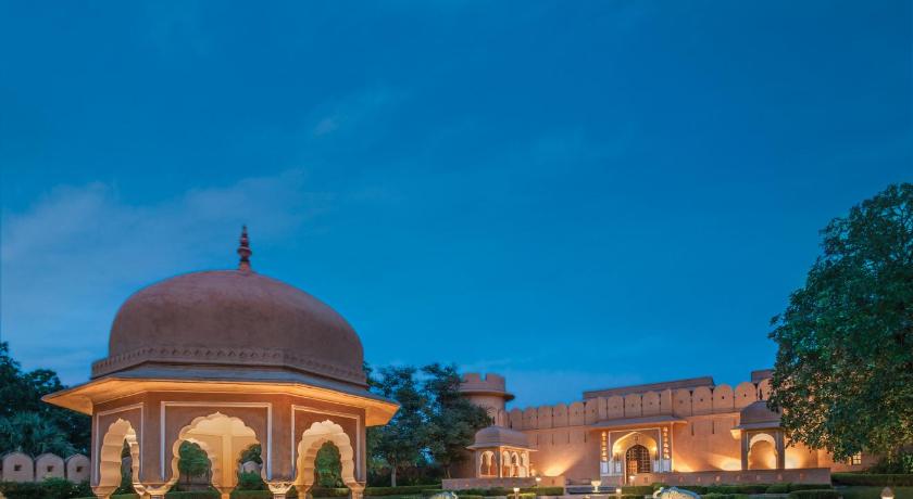a large stone building with a fountain in front of it, The Oberoi Rajvilas Jaipur Hotel in Jaipur