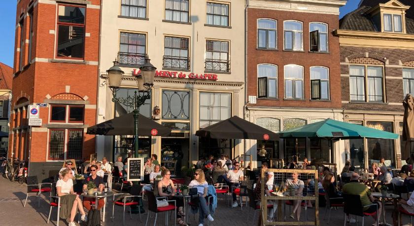 people are gathered outside of a restaurant, Hotel de Gaaper in Amersfoort
