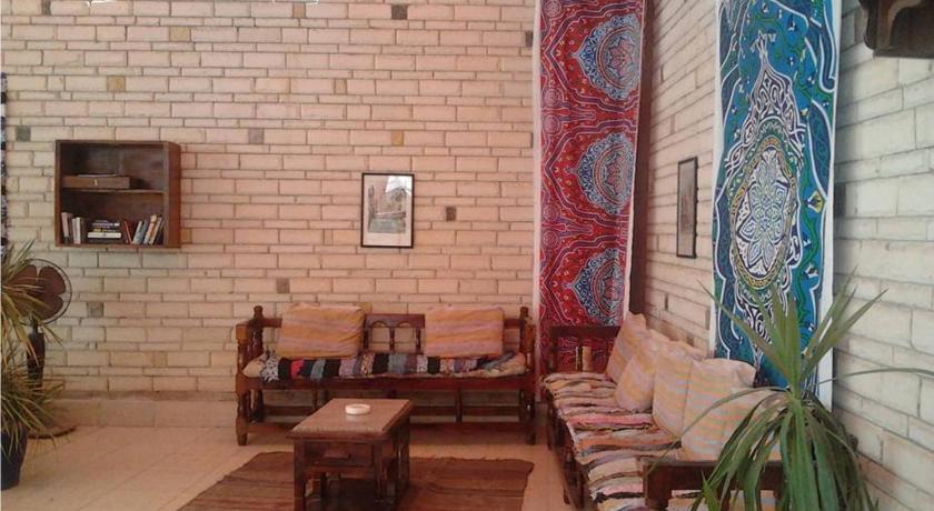a living room with a couch and a table, Nile Valley Hotel in Luxor