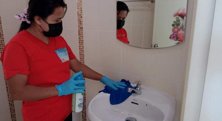 a woman cleaning a sink in a bathroom, Cha-Am Fish Star in Hua Hin / Cha-am