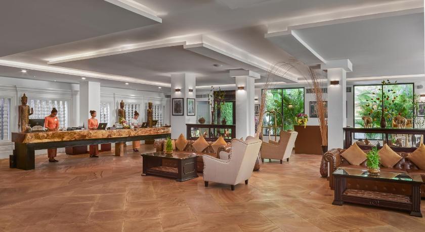 a living room filled with furniture and people, Palace Gate Hotel & Resort in Phnom Penh