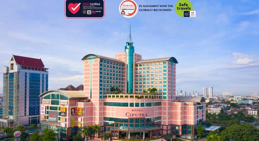 a large building with a clock on the top of it, Hotel Ciputra Jakarta managed by Swiss-Belhotel International in Jakarta