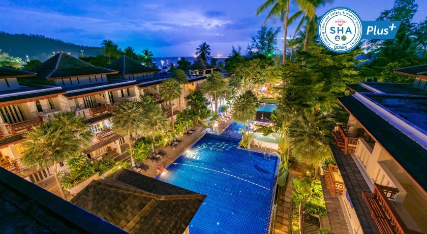 a large pool of water surrounded by trees, Koh Tao Montra Resort & Spa (SHA Plus+) in Ko Tao